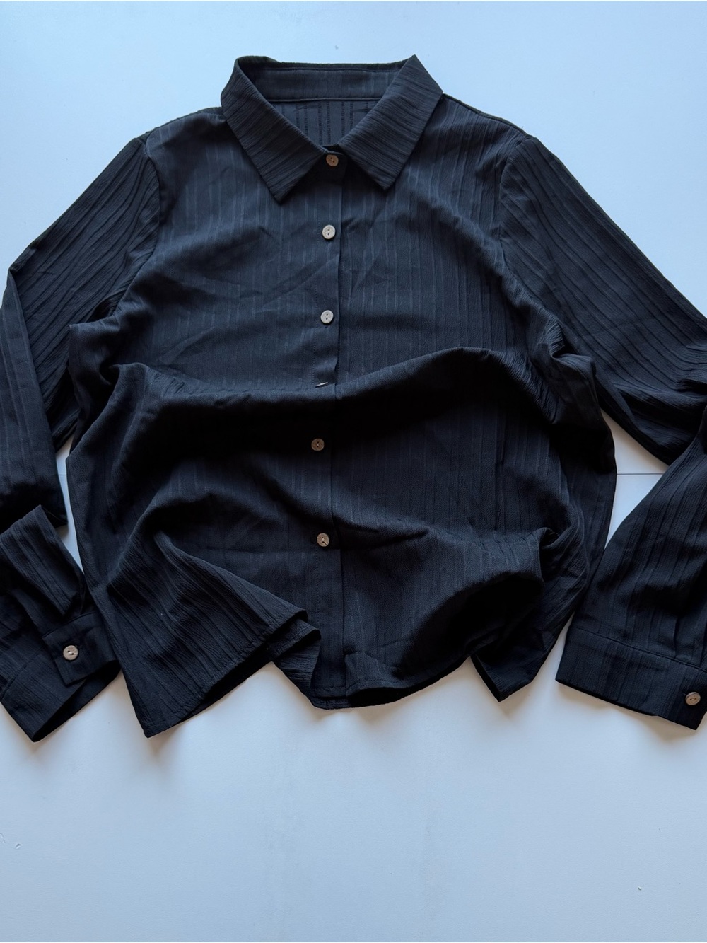 Men's Black Long-Sleeve Button-Down Shirt with Subtle Stripe Detail